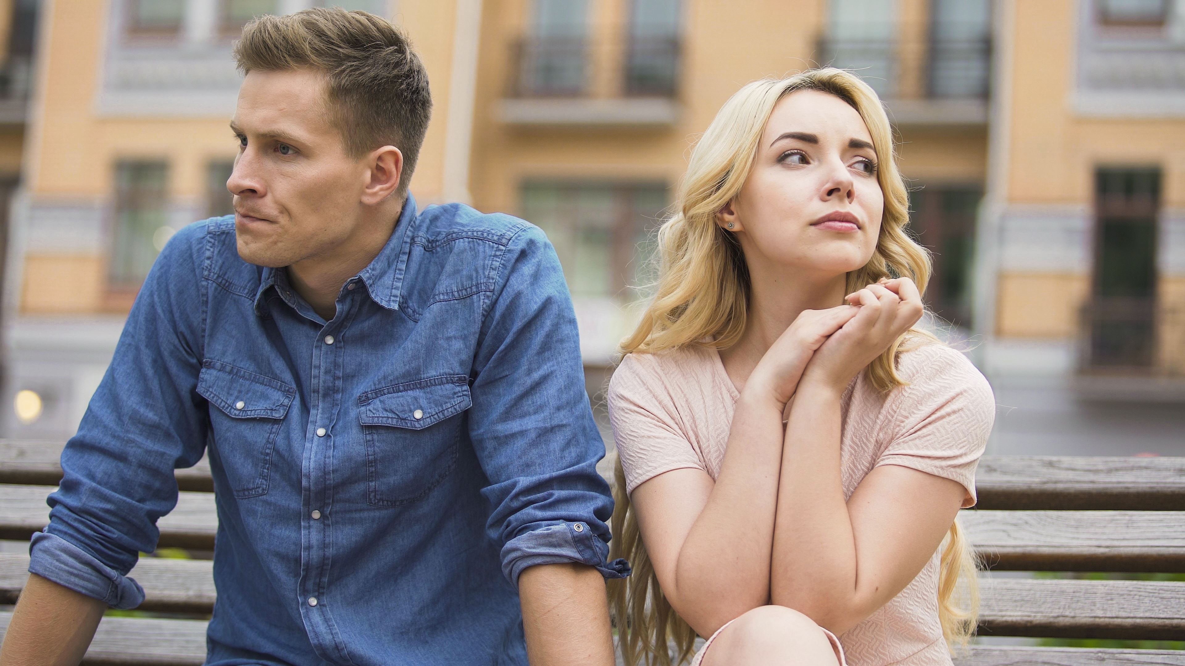 Divorcing couple in OKC sitting on steps in 73118